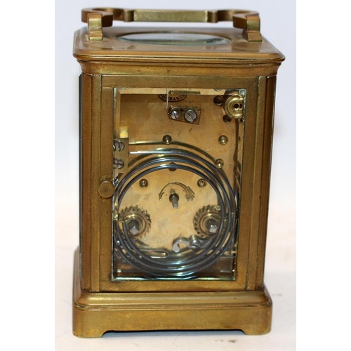 65 - Quality French brass carriage clock with bevelled glass panels. 11.5cms tall. Was working prior to b... 