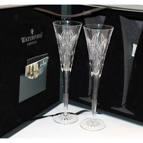 97 - Waterford Crystal Wishes 'Happy Anniversary' champagne flutes. Four glasses sold as two pairs, in pr... 