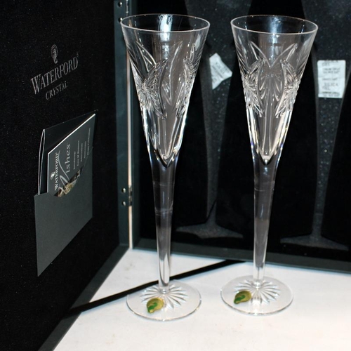 97 - Waterford Crystal Wishes 'Happy Anniversary' champagne flutes. Four glasses sold as two pairs, in pr... 