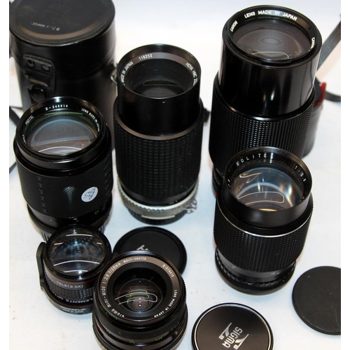 194 - A collection of vintage camera lenses, Canon, Nikon, Sigma etc