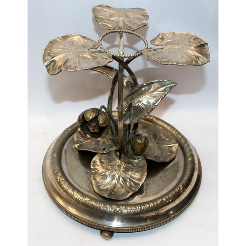 215 - Victorian silver plated table centrepiece featuring emerging water lilies. 25cms tall. Discreet insc... 