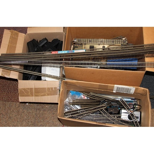 234 - A large quantity of OO gauge 2 rail and 3 rail track c/w other track related items.