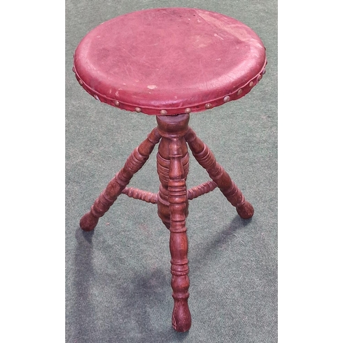 265 - Antique height adjustable corkscrew piano stool on tripod base with leather seat pad.