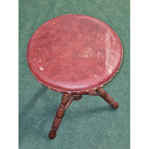 265 - Antique height adjustable corkscrew piano stool on tripod base with leather seat pad.