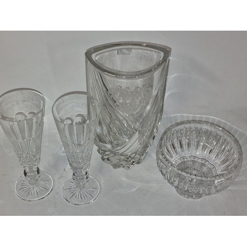 288 - Four pieces of Waterford Crystal to include a bowl, a vase, and two vintage glasses