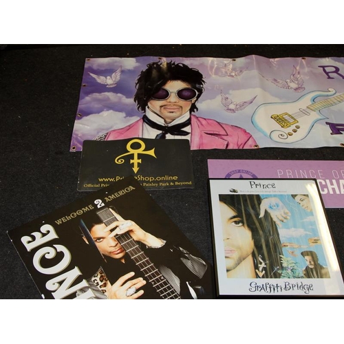 174 - Large collection of Prince music artist memorabilia including framed posters, magazines containing a... 