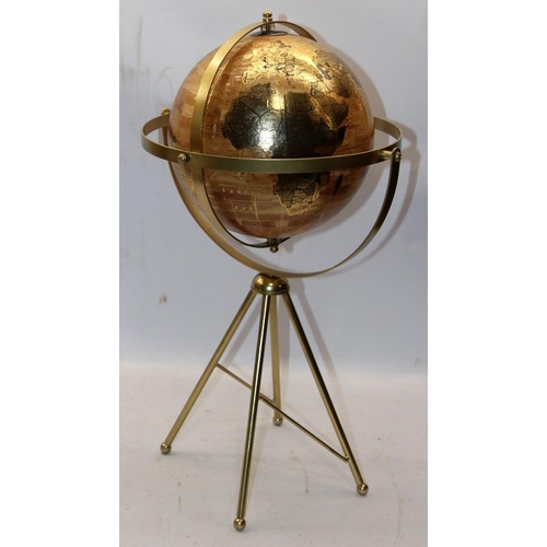 259 - World globe with twin axis 720° swivel on four brass legs, O/all height 54cms