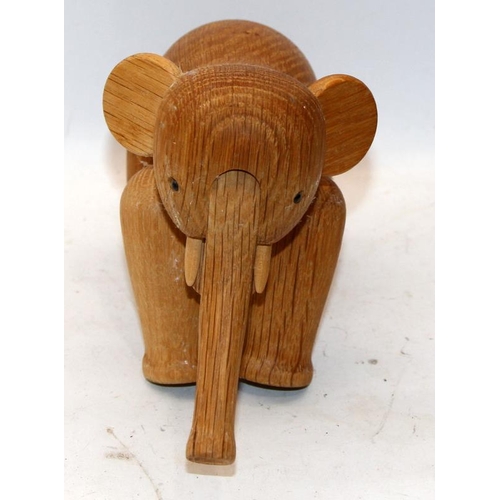 291 - Kay Bojensen - Denmark: Mid Century articulated wooden elephant figure. 24cms across (with trunk ext... 