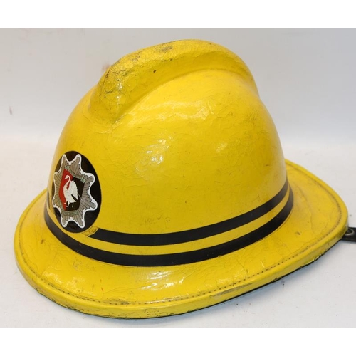 160 - Two Fireman's helmets, an American Ladder 92 LAFD helmet c/w a vintage Buckinghamshire Fire and Resc... 