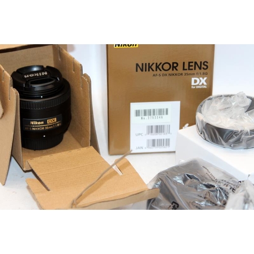 14 - Boxed Nikon Nikkor AF-S DX 35mm F:1.8G lens, comes in original packaging c/w lens hood and soft prot... 