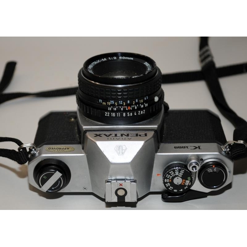 140 - Vintage Pentax K1000 35mm film SLR camera c/w Pentax-M 1:2 50mm prime lens. Film advance smooth, shu... 