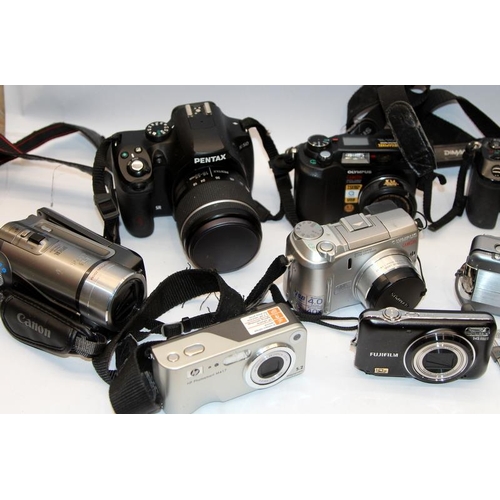 145 - A collection of digital cameras including Pentax, Olympus, Canon etc. All offered untested