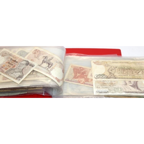 150 - Two small albums of assorted world banknotes c/w two mounted Polish 500 Zlotych notes