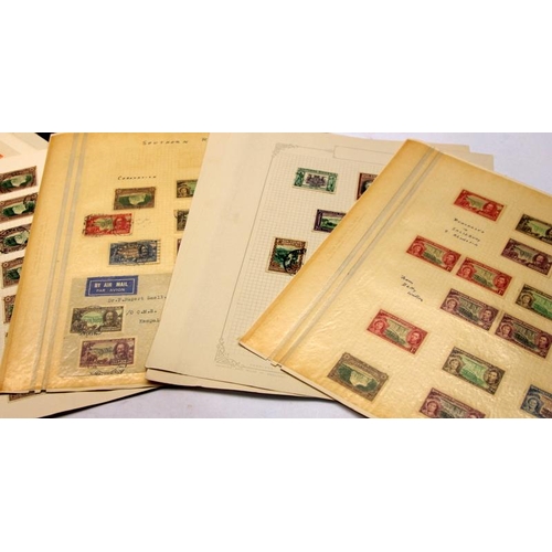 171 - A number of loose album leaves containing a collection of world stamps including early examples, goo... 