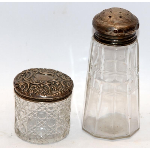 327 - Sterling silver topped sugar sifter c/w a silver topped dressing table jar