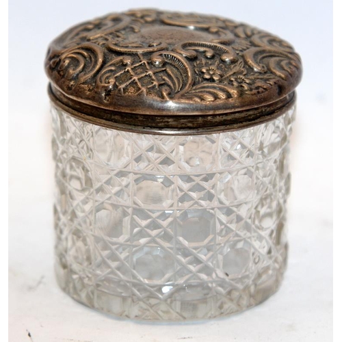 327 - Sterling silver topped sugar sifter c/w a silver topped dressing table jar