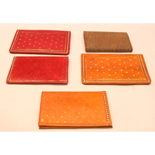 99 - A collection of vintage as new Moroccan tooled leather wallets and purses