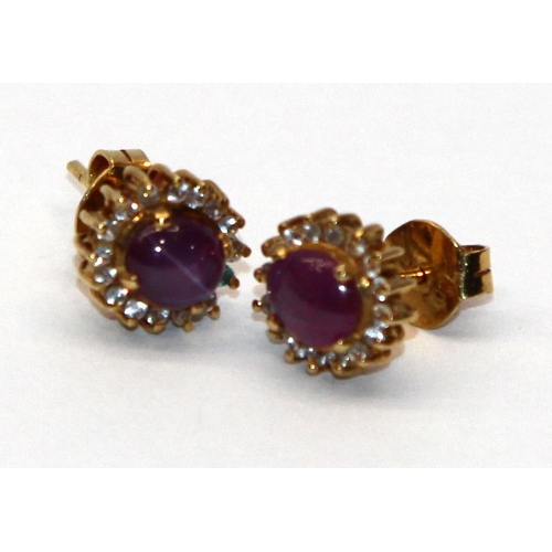 346 - Pair of 18ct gold earrings featuring central cabochon polished amethyst surrounded by approx 15 smal... 