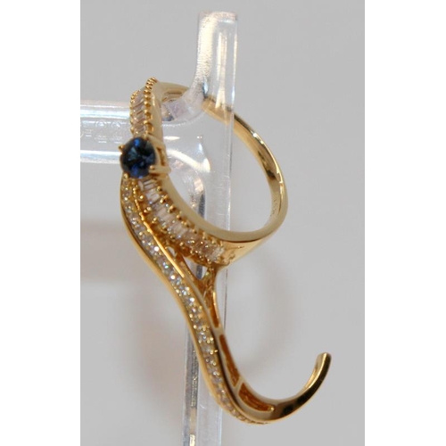 369 - Very unusual and striking 18ct gold double shank sapphire and diamond ring designed to be worn over ... 