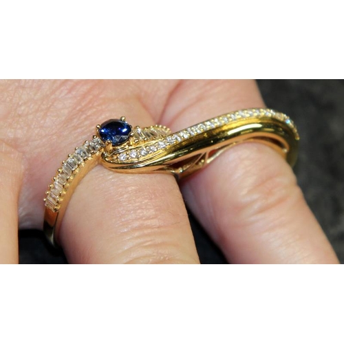 369 - Very unusual and striking 18ct gold double shank sapphire and diamond ring designed to be worn over ... 