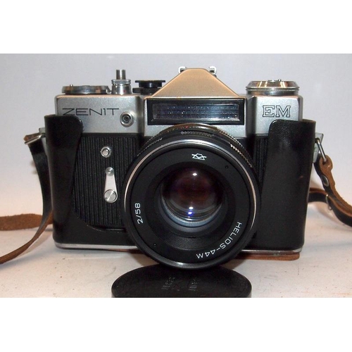 22 - Vintage Zenit EM 35mm SLR camera with 56mm prime lens. Lot also includes two further lenses with m48... 