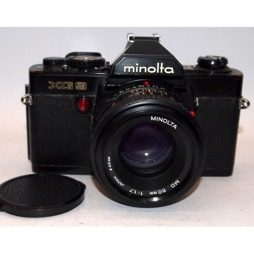 25 - Vintage Minolta XG9 35mm film SLR camera c/w 1:1.7 50mm and 1:5.6 100-200mm lenses. Good cosmetic co... 