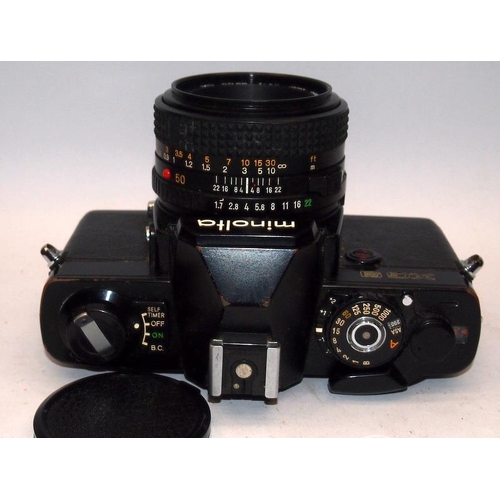 25 - Vintage Minolta XG9 35mm film SLR camera c/w 1:1.7 50mm and 1:5.6 100-200mm lenses. Good cosmetic co... 