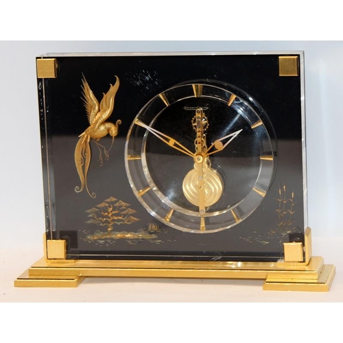 226 - Jaeger Lecoultre 1960's Mystery Clock in a Lucite case decorated with gilded chinoiserie bird and fo... 