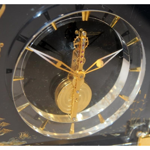 226 - Jaeger Lecoultre 1960's Mystery Clock in a Lucite case decorated with gilded chinoiserie bird and fo... 