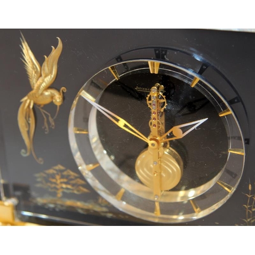 226 - Jaeger Lecoultre 1960's Mystery Clock in a Lucite case decorated with gilded chinoiserie bird and fo... 