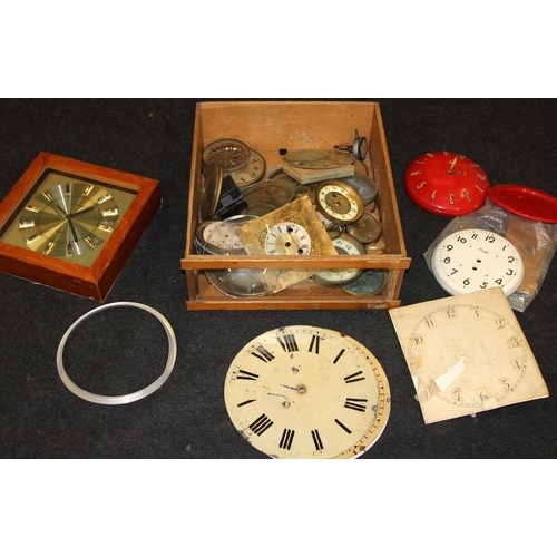 247 - Three large drawers of clock spares including dials and movements. Good lot to sort through