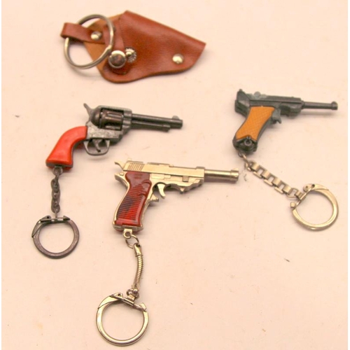 267 - 3 x vintage miniature key ring cap guns, one with holster c/w 3 x miniature cannon