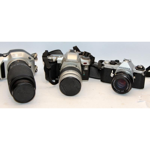 294 - A collection of cameras and lenses to include 35mm SLR and digital examples. Nikon Pentax, Canon, Lu... 