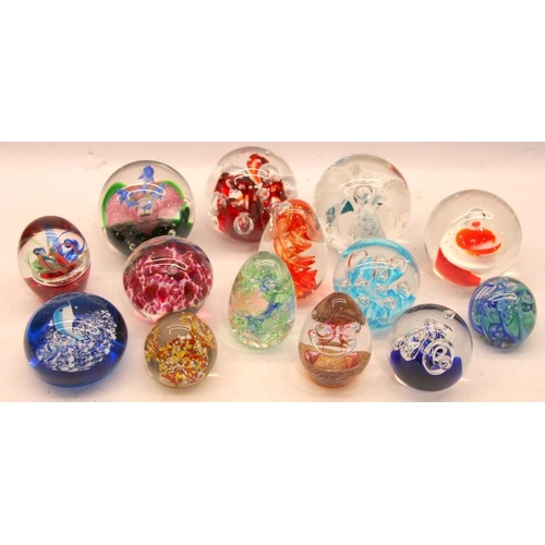 299 - A collection of glass paperweights. 14 in lot