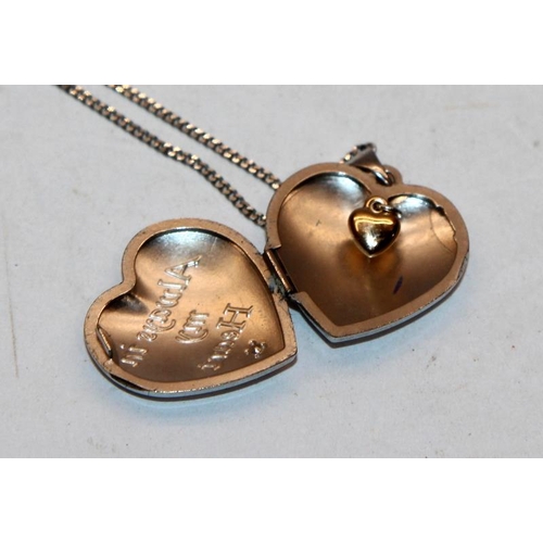 365A - Sterling silver and diamond heart locket pendant containing a 9ct gold heart on an 18