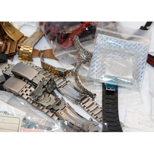 381 - A collection of watch straps and other spares, including brand new Pulsar and Lorus stainless steel ... 