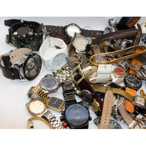 382 - A large collection of ladies and gents fashion watches