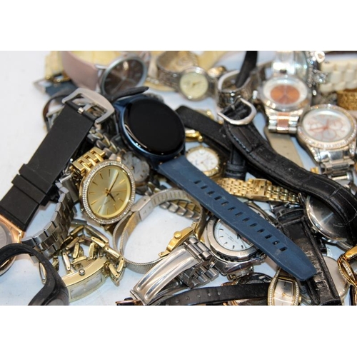 384 - A large collection of ladies and gents fashion watches