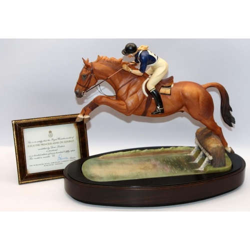 322 - Royal Worcester equestrian statuette of HRH The Princess Anne riding Doublet, taking a water jump. D... 