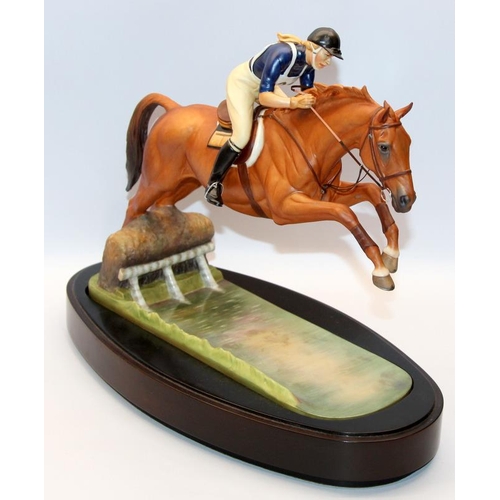 322 - Royal Worcester equestrian statuette of HRH The Princess Anne riding Doublet, taking a water jump. D... 