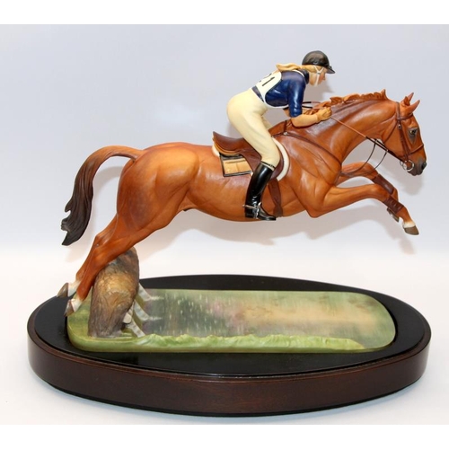 322 - Royal Worcester equestrian statuette of HRH The Princess Anne riding Doublet, taking a water jump. D... 