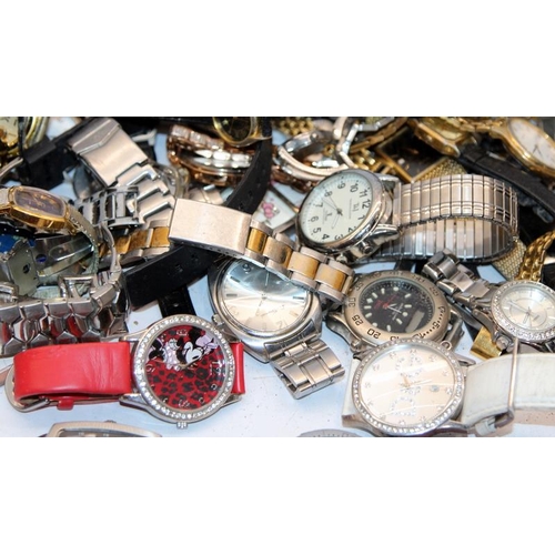 346 - A large collection of ladies and gents fashion watches, all offered untested