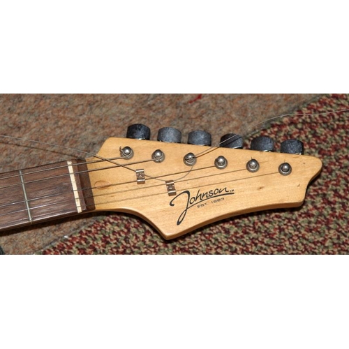 293 - Johnson electric strat guitar, metallic blue body with white scratchplate.