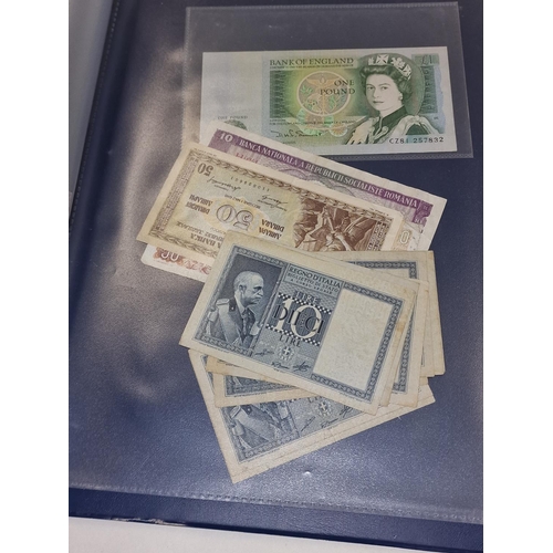 100 - A blue album containing 47 world banknotes.