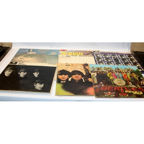 74 - A collection of vinyl LP's to include several Beatles albums, rock, pop etc