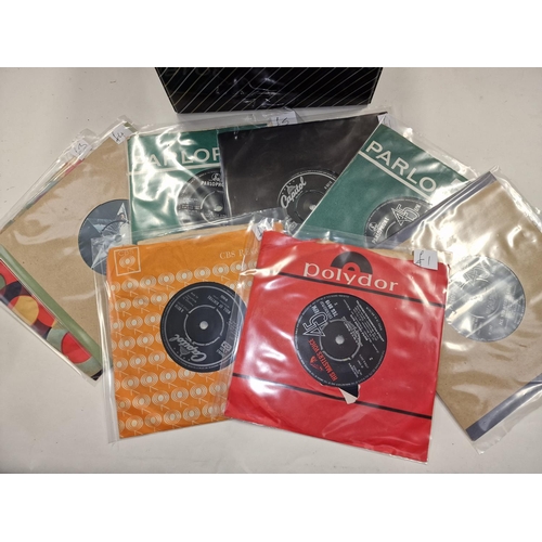 234 - Carry case of collectable 45rpm singles. Includes man examples by The Beatles as well as Elvis Presl... 