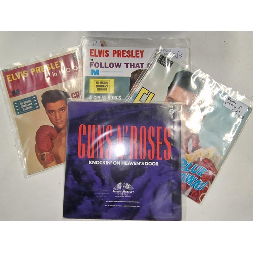 234 - Carry case of collectable 45rpm singles. Includes man examples by The Beatles as well as Elvis Presl... 