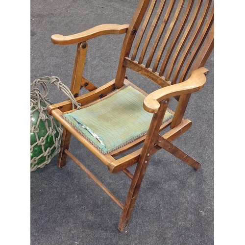 173 - Antique folding wooden campaign chair together with a vintage glass fishing float.