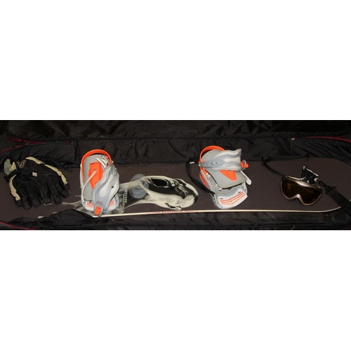 387 - Rossignol Sly 154 Snowboard, 2 pairs of Burton snowboard boots size UK6, gloves and goggles all cont... 