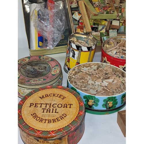 168 - Good collection of mainly vintage wooden jigsaw puzzles contained within several tins. Not checked f... 